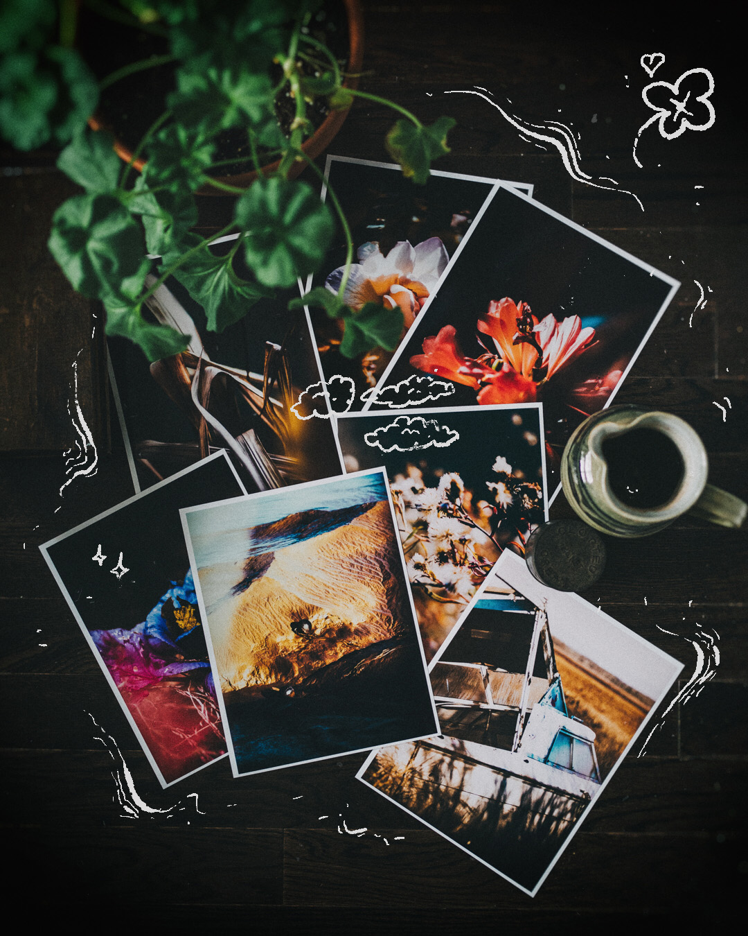 Collection of physical photos lying on the floor with doodles drawn over top.